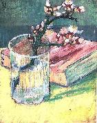 Blossoming Almond Branch in a Glass with a Book